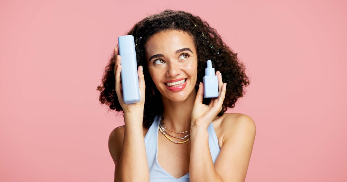Skincare, happy woman and beauty product in studio, serum treatment or headband for wellness shine. Healthy glow, clear skin or person with facial cleanser for dermatology, space or pink background
